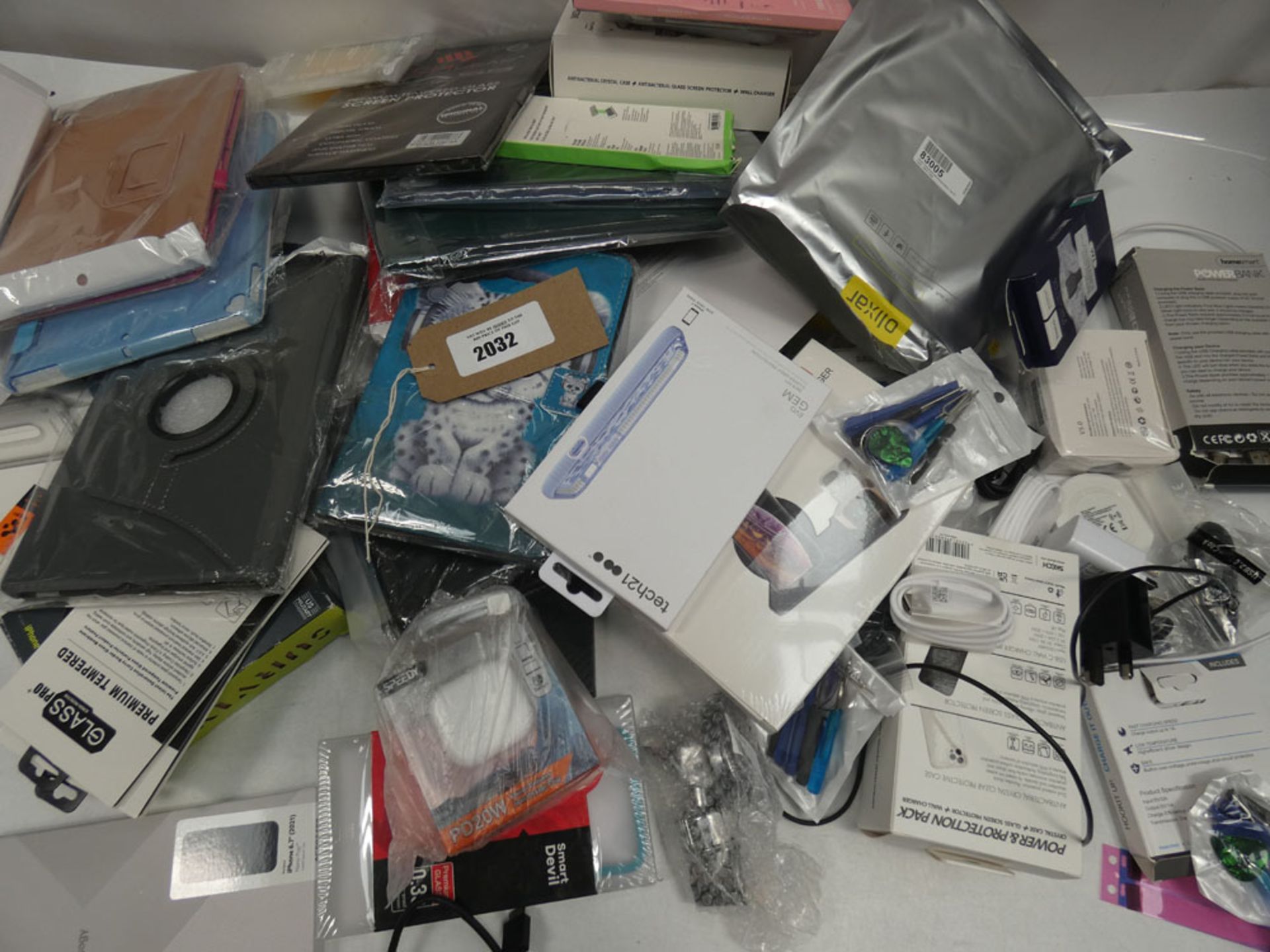 Bag containing quantity of mobile phone cases, covers, adapters, chargers, etc