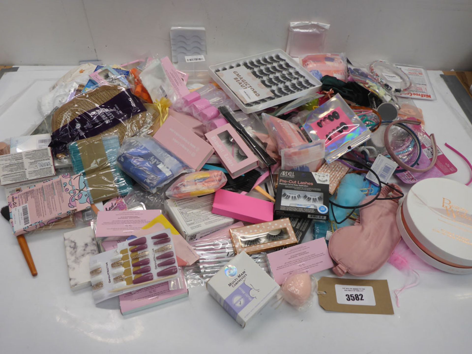 Large bag of beauty products including hair extension & hair decoration, false eyelashes & nails,