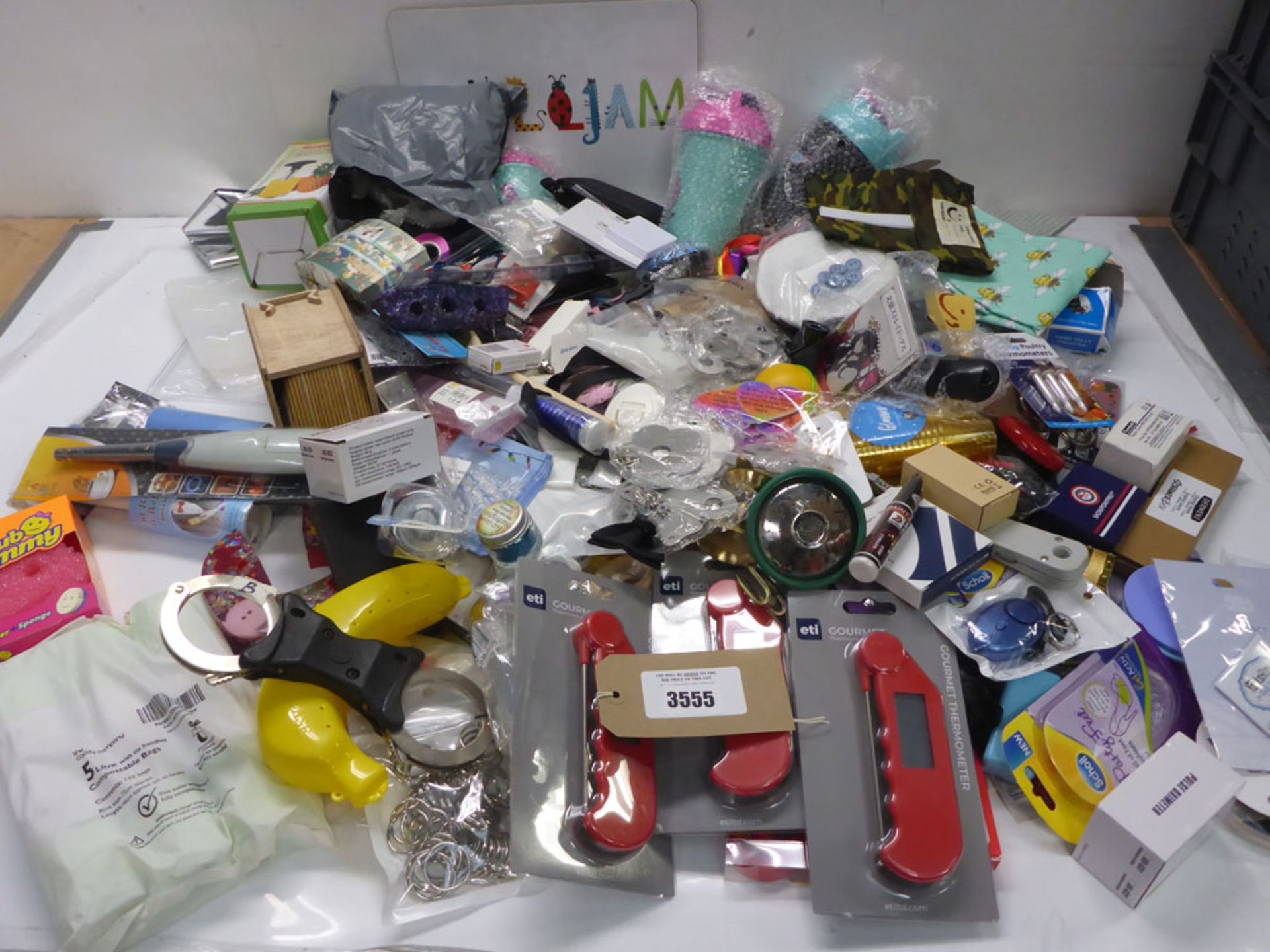 Large bag of household sundries, handcuffs, Gourmet digital thermometers, waste bags, water bottles,