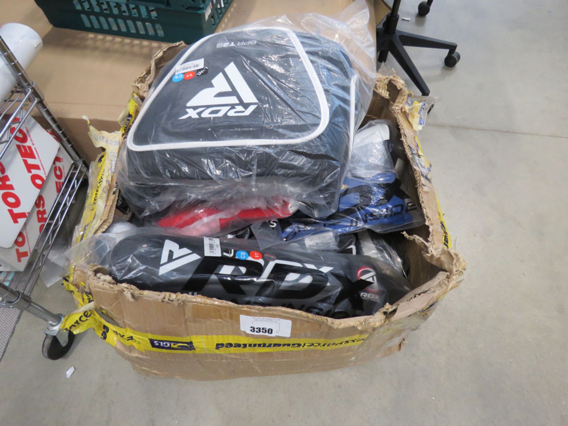 Large box of mixed RDX combat gear incl. gloves, sparring pads, helmets etc.