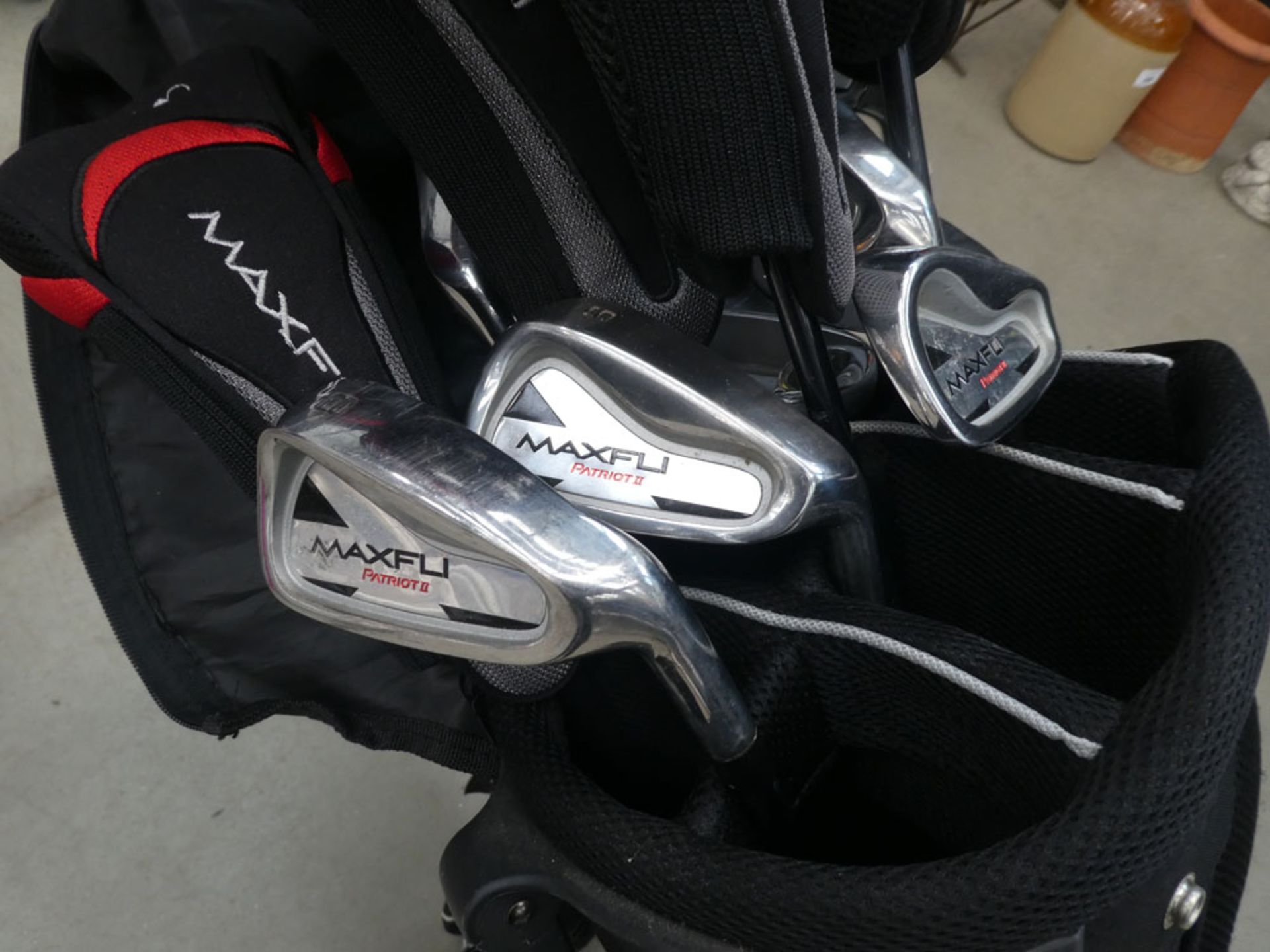 Red and black golf bag with quantity of Maxfli clubs - Image 2 of 2