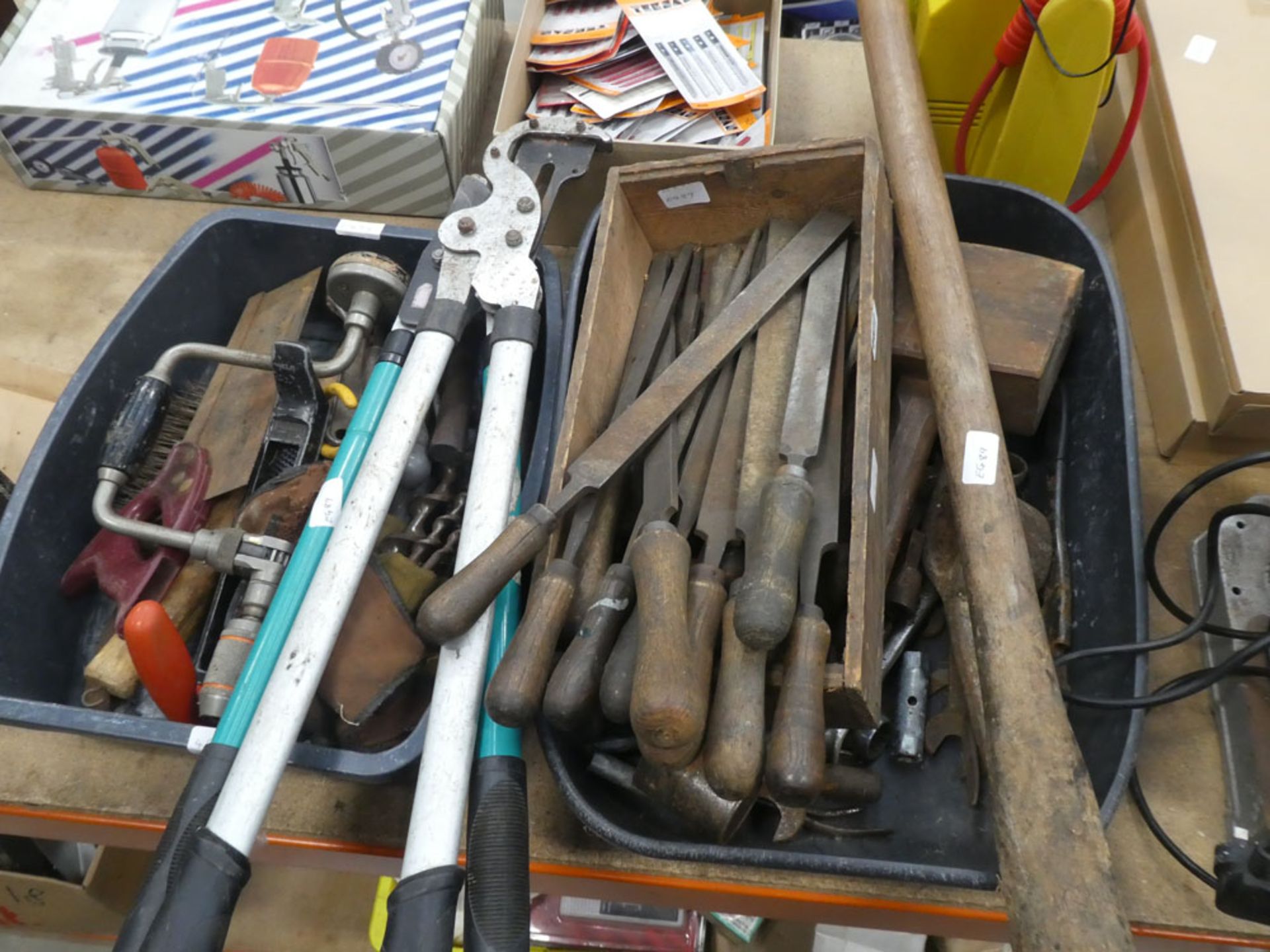 2 plastic crates containing various tools including files, hedge cutters, saws, hand drills,