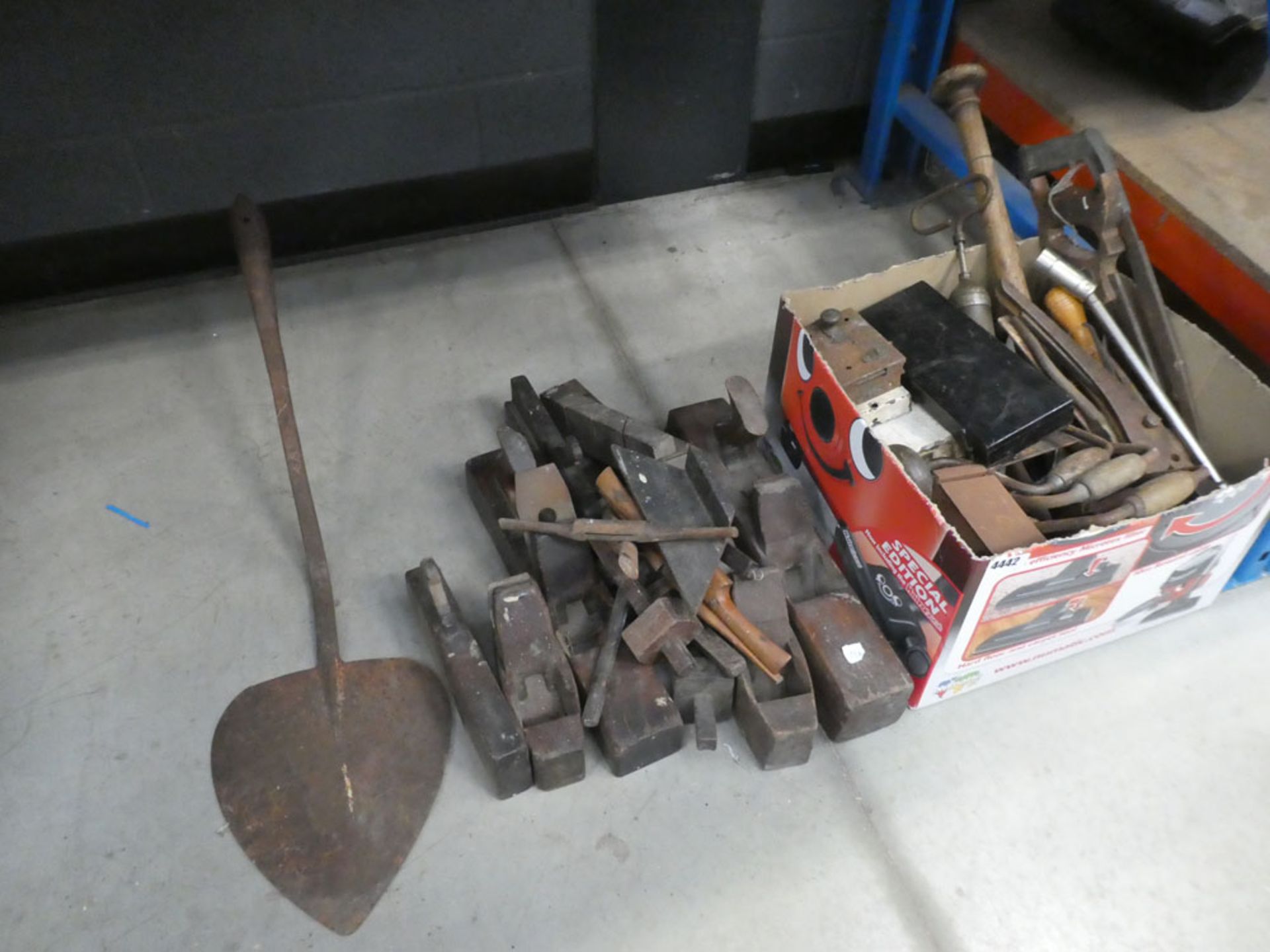 Half an underbay of vintage tools including planes, peat shovel heads, saws, hand drills, etc