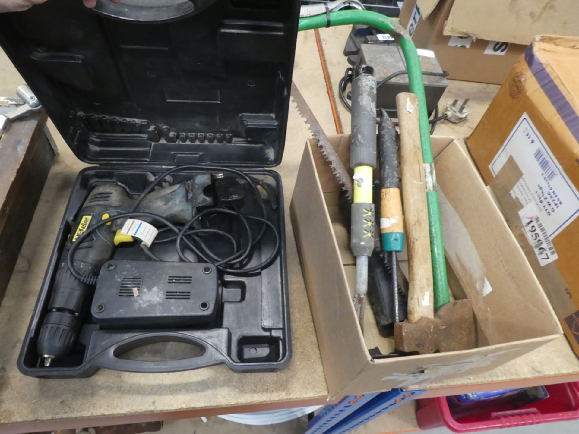 McKeler battery drill, no battery, 1 charger plus a small box cont. axe, saw and a torch
