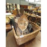 Wicker basket with a fly whisk, carved African head and two Zulu dancing shields