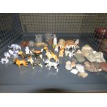 Cage containing rock examples plus ornamental dogs, cats and other figures