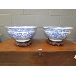 Pair of blue and white dragon decorated bowls on stands