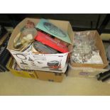 4 boxes containing wine glasses, dolls, sporting equipment, ornamental figures plus a quartz clock