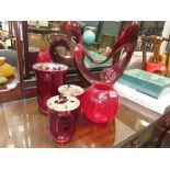 Red painted centre piece plus 4 red glass vases