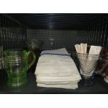 Cage containing dishcloths, lemonade jugs, decanter and vases