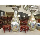 Pair of modern Oriental vases with stands