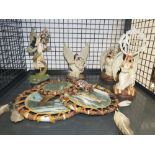 Cage containing dreamcatchers and resin figures of Native American Indians