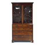 An early 19th century mahogany and astragal glazed bookcase,