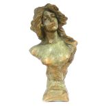 A green-patinated composite bust modelled as a young lady, hair cascading down her exposed chest, h.