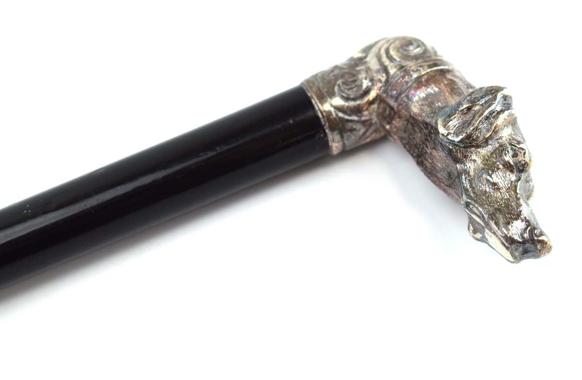 An ebonised walking cane with a Russian silver mounted pommel modelled as a hound, - Image 2 of 4