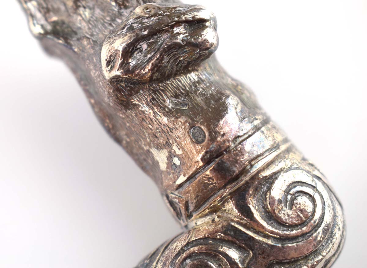 An ebonised walking cane with a Russian silver mounted pommel modelled as a hound, - Image 3 of 4