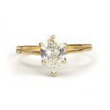 A 14ct yellow gold ring set teardrop diamond in a six claw setting within a split band shank,