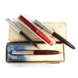 A group of pens including two Parker 51 fountain pens a matching biro and a Conway pen (4)