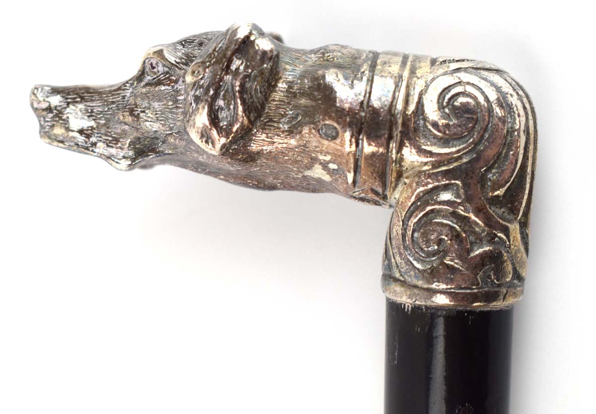 An ebonised walking cane with a Russian silver mounted pommel modelled as a hound, - Image 4 of 4