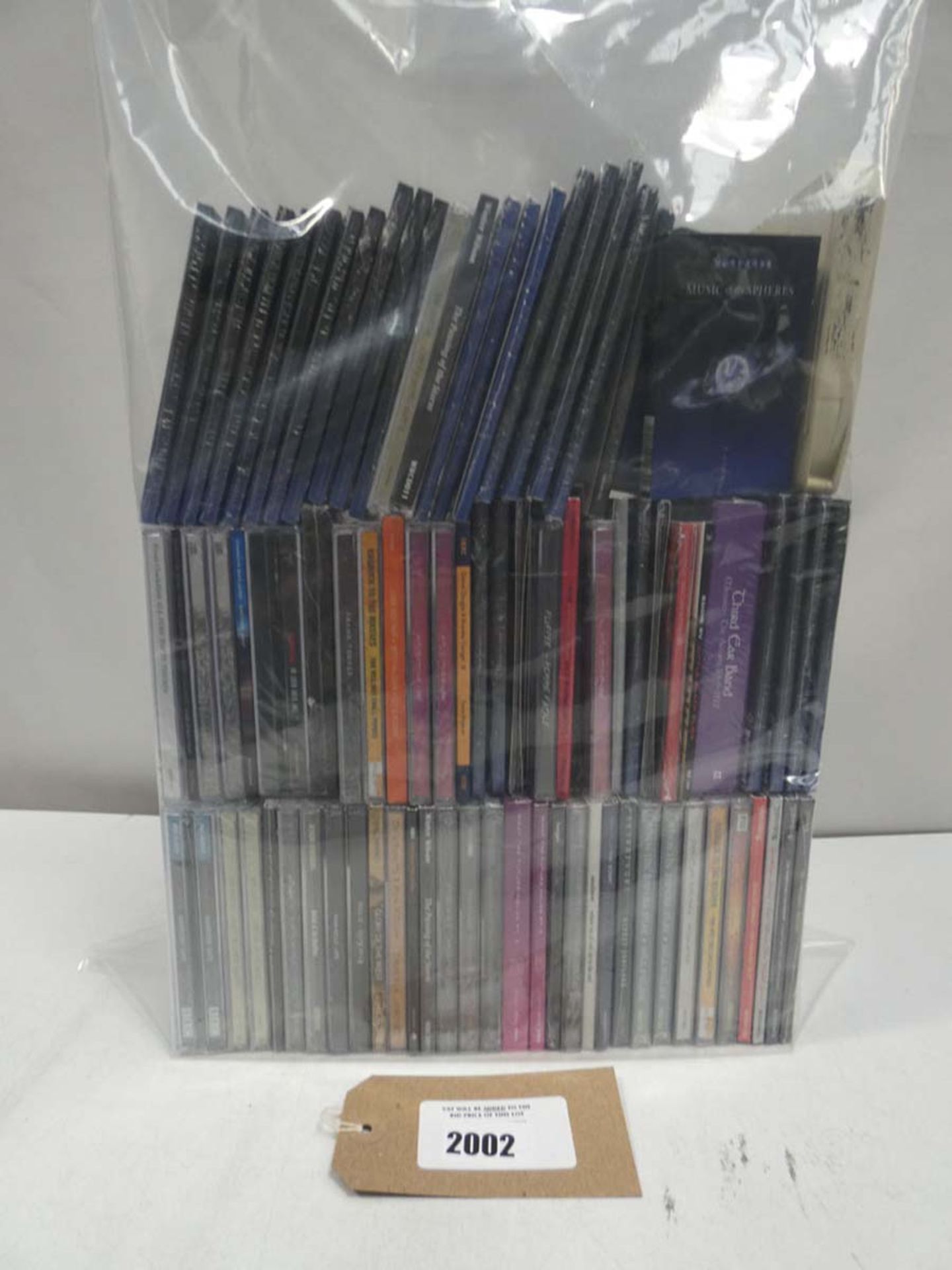 Bag containing various music CD albums