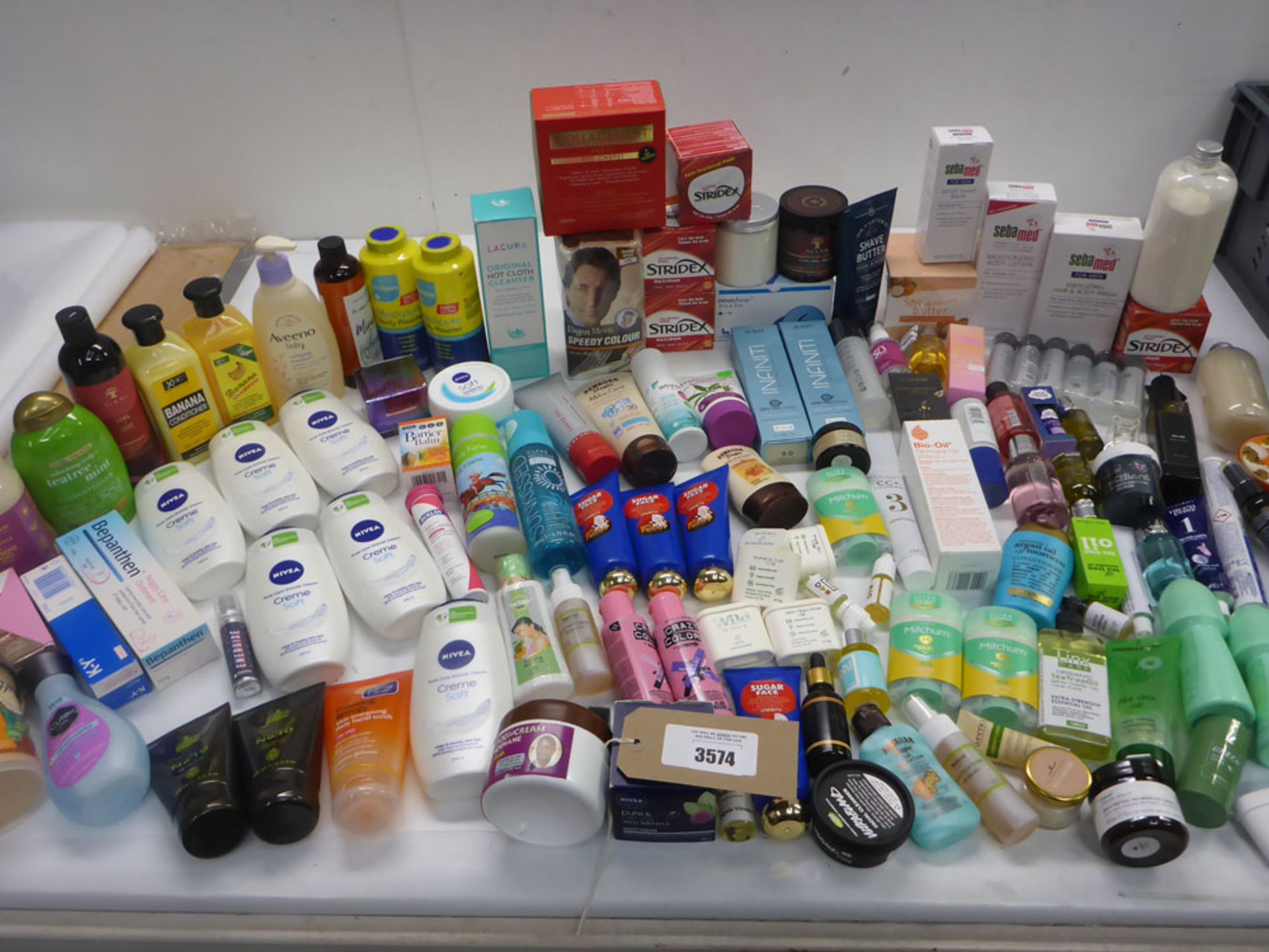 Large bag of toiletries including cleanser, shower cream, lotions, shave balm, hair products, anti-