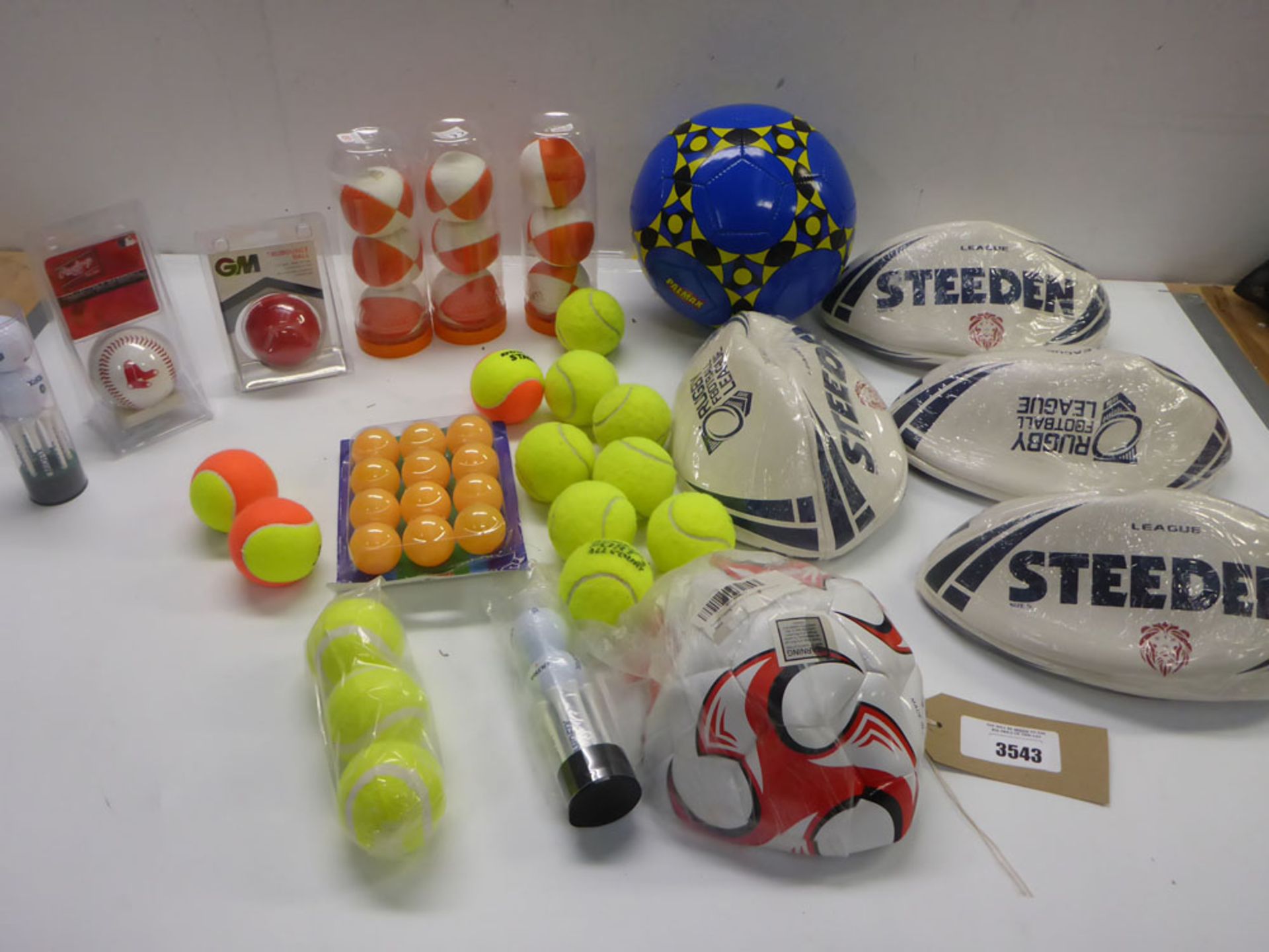 Selection of tennis, golf, rugby, cricket, pingpong and footballs