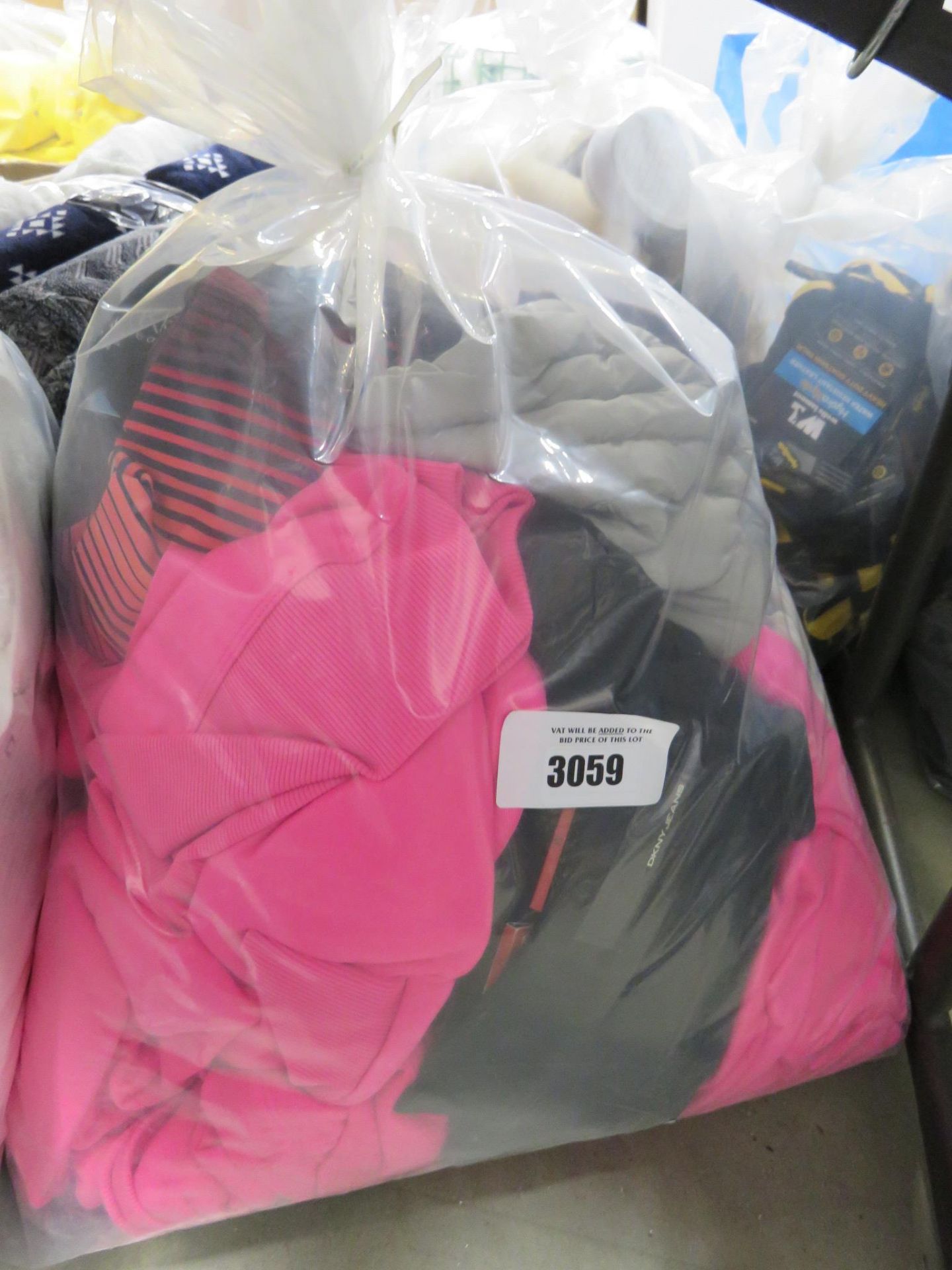 Bag containing 3 DKNY pink ladies hoodies, 32 Degree Cool trousers, 32 Degree grey hoodie, jeans,