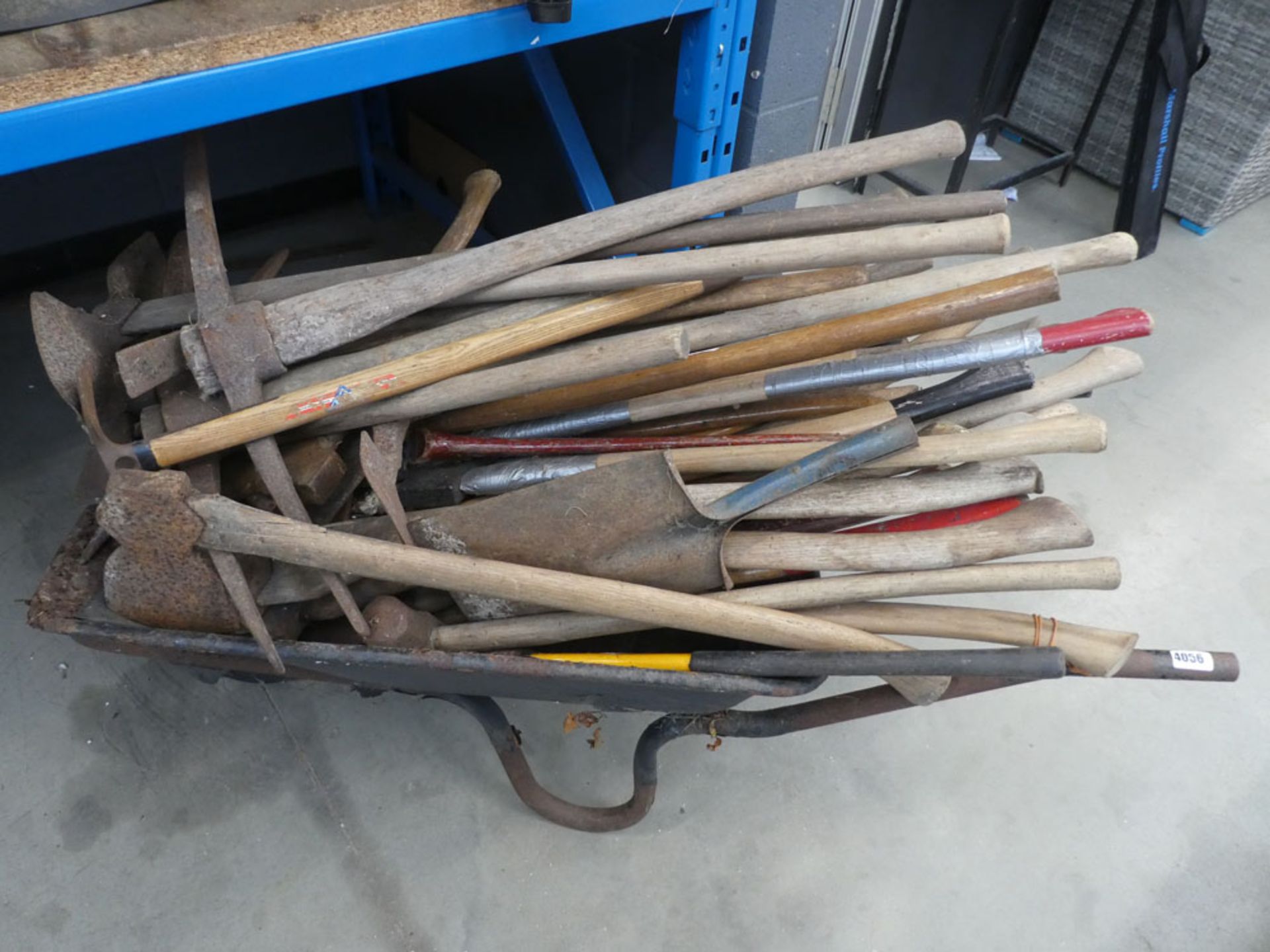 Wheelbarrow of assorted garden tools