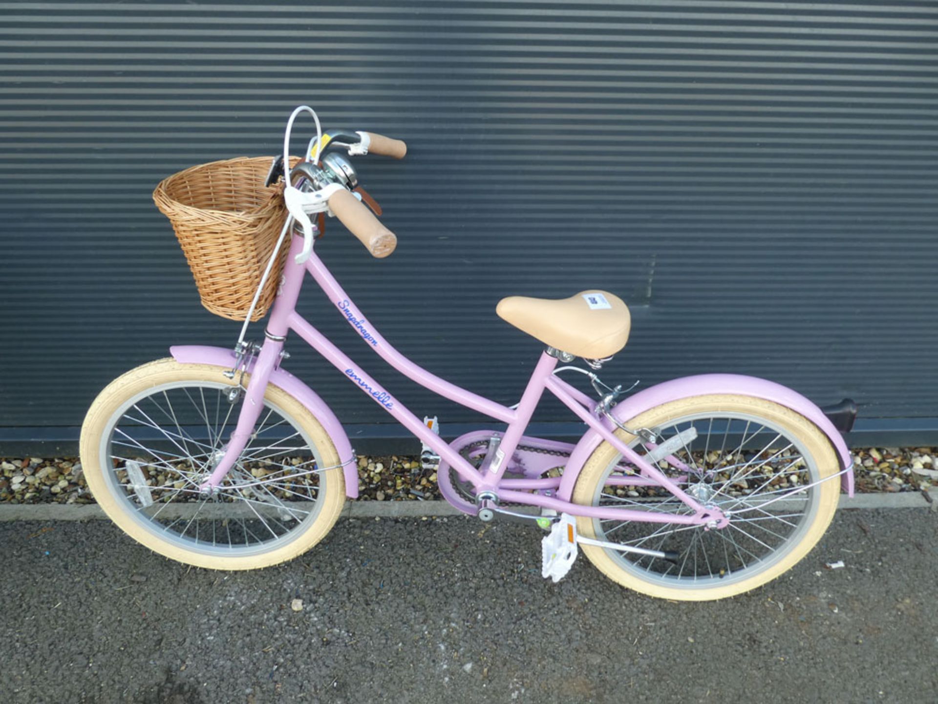Pink small childs bike with front basket