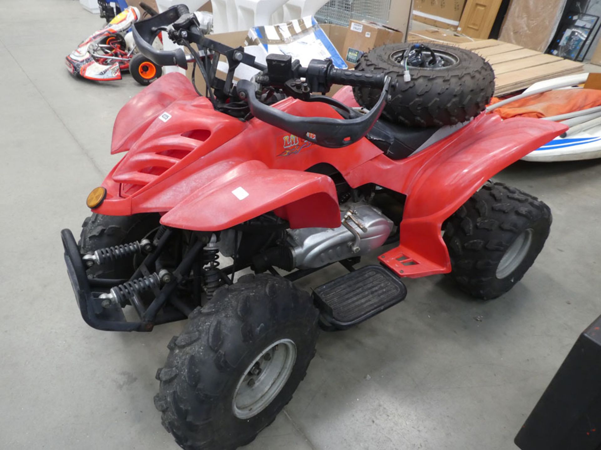 100cc Lil Devil red petrol powered quad bike with spare wheel and back rack