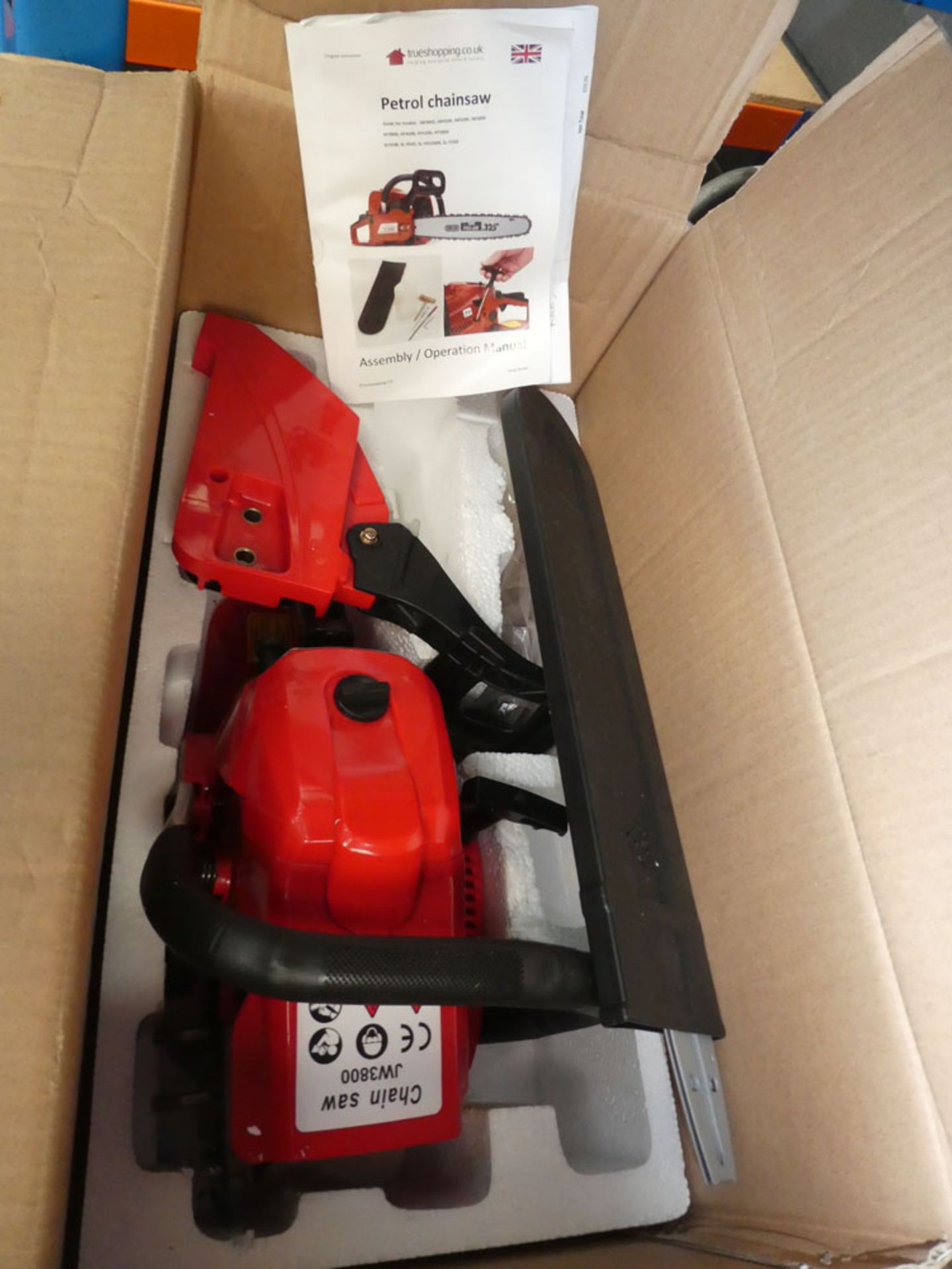 Red petrol powered True Shopping boxed chain saw