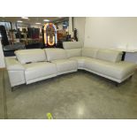 Cream leather effect reclining corner sofa in two sections