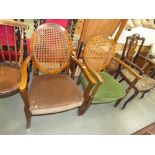 Pair of bergere chairs with brown and green upholstery