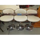 3 chrome based cream topped barstools