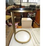 Darkwood circular coffee table on gold metal supports