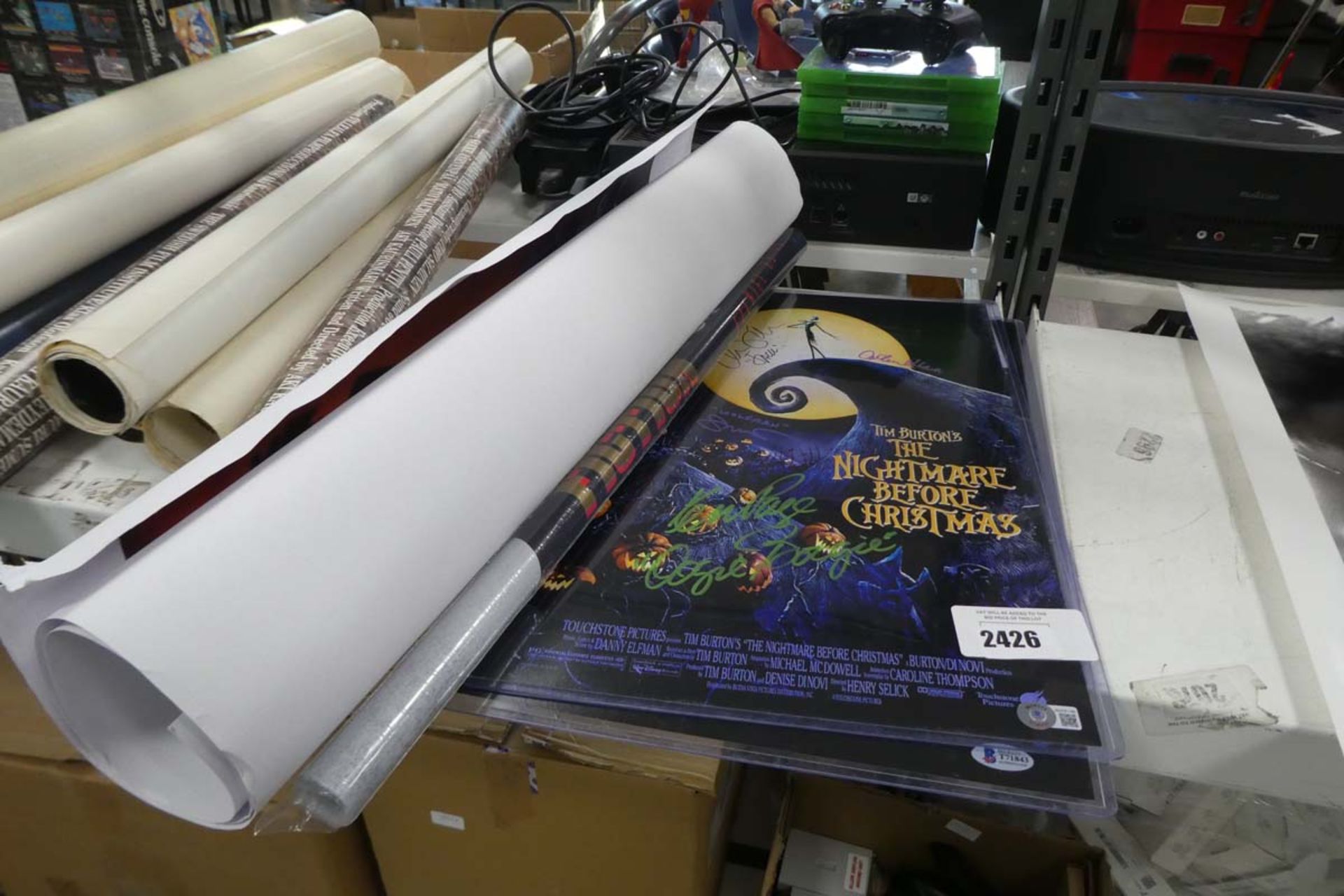 2 signed Tim Burton's The Nightmare Before Christmas posters together with a Pulp Fiction poster and