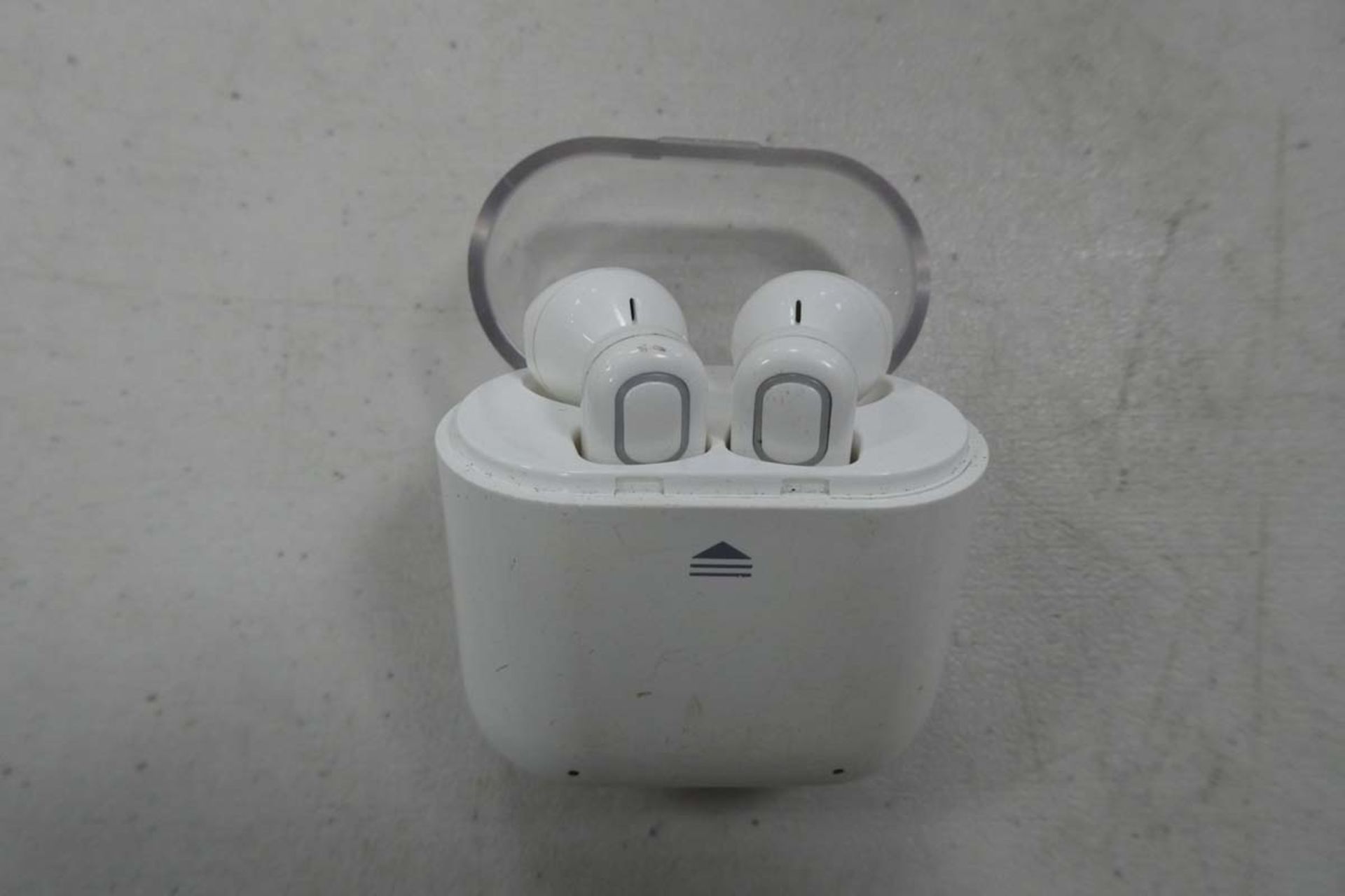 Pair of white rechargeable earbuds