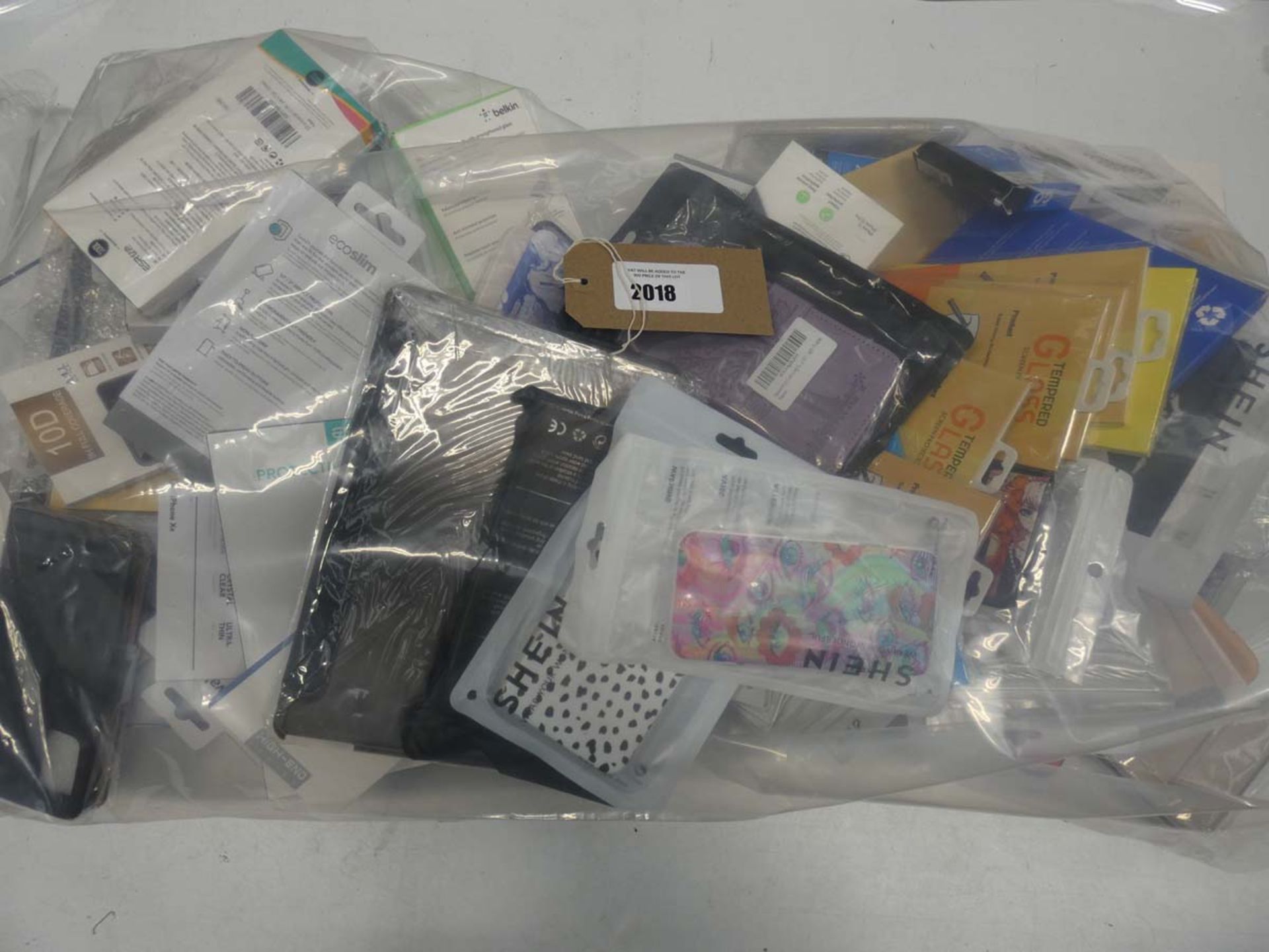 Bag containing quantity of mobile phone cases and covers