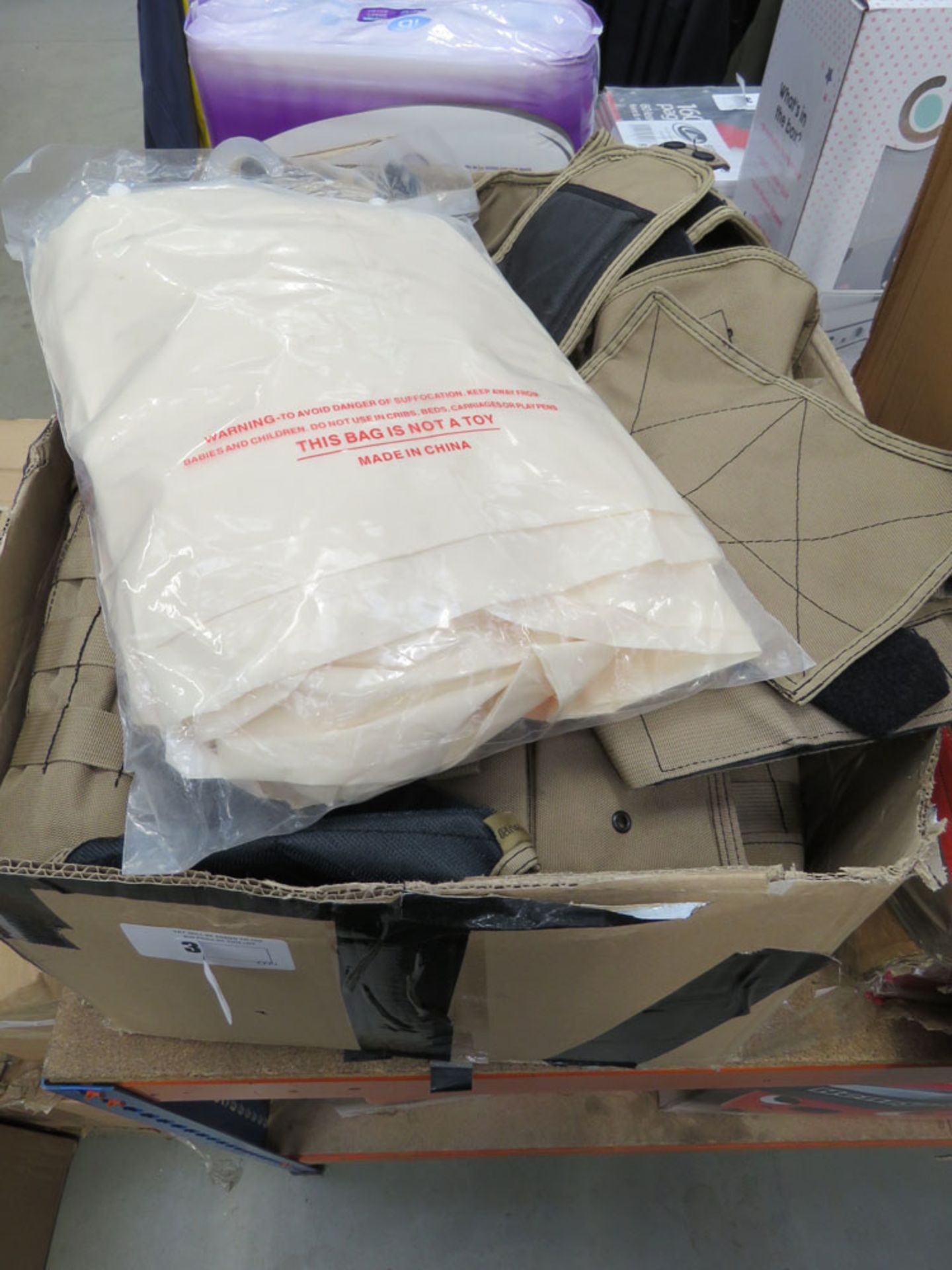 Box containing military style combat vests and webbing