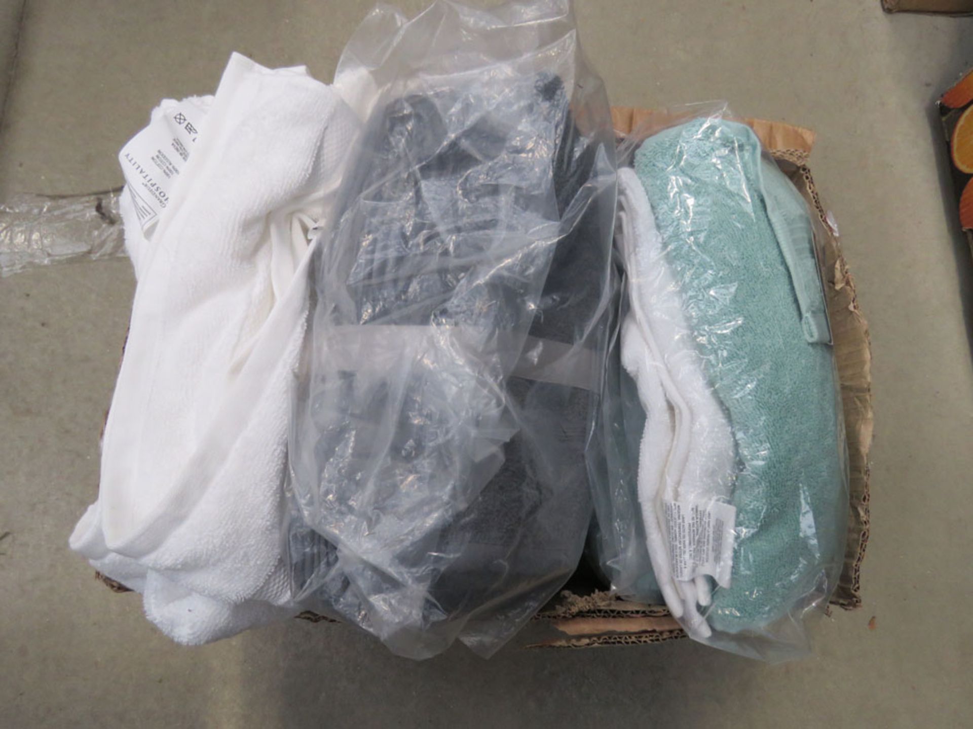 Box containing various bath towels