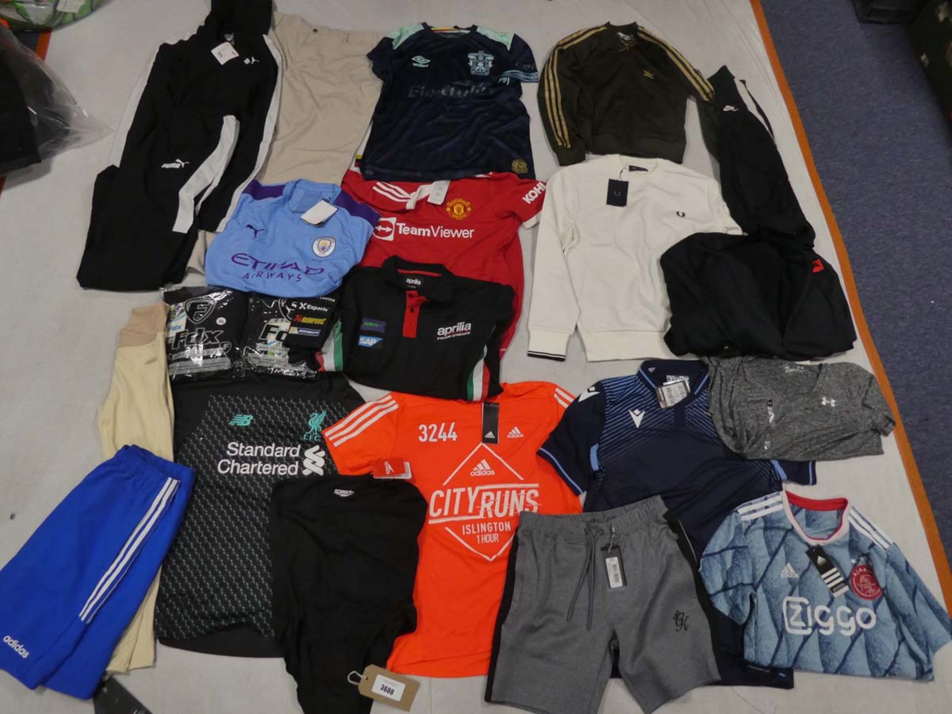 Selection of sportswear to include Nike, Adidas, Fred Perry, Callaway, etc