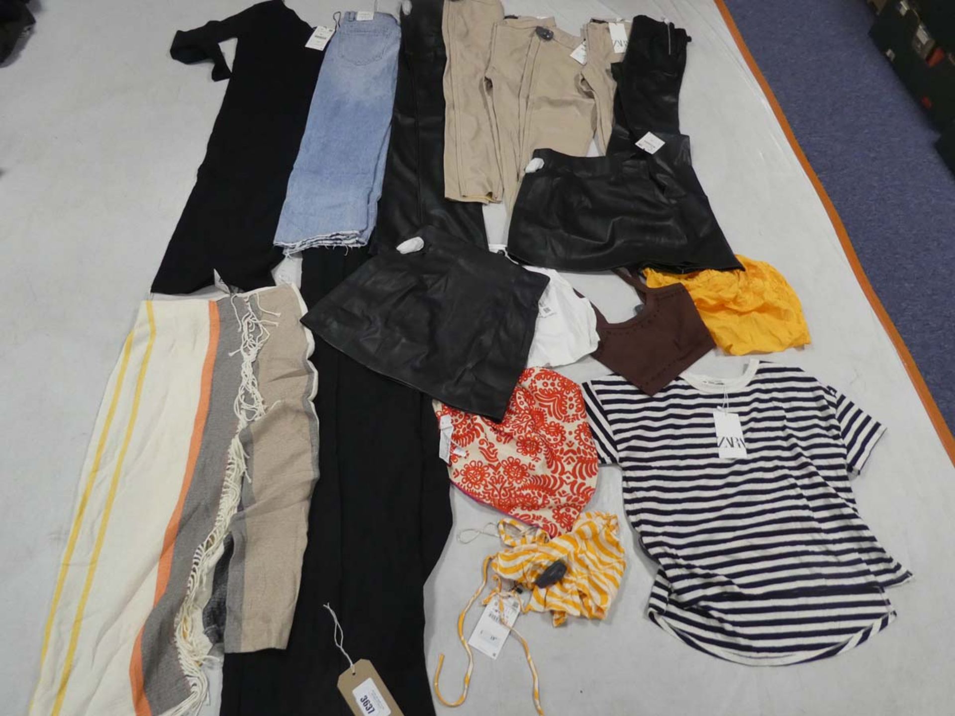 Selection of Zara clothing all with security tags attached