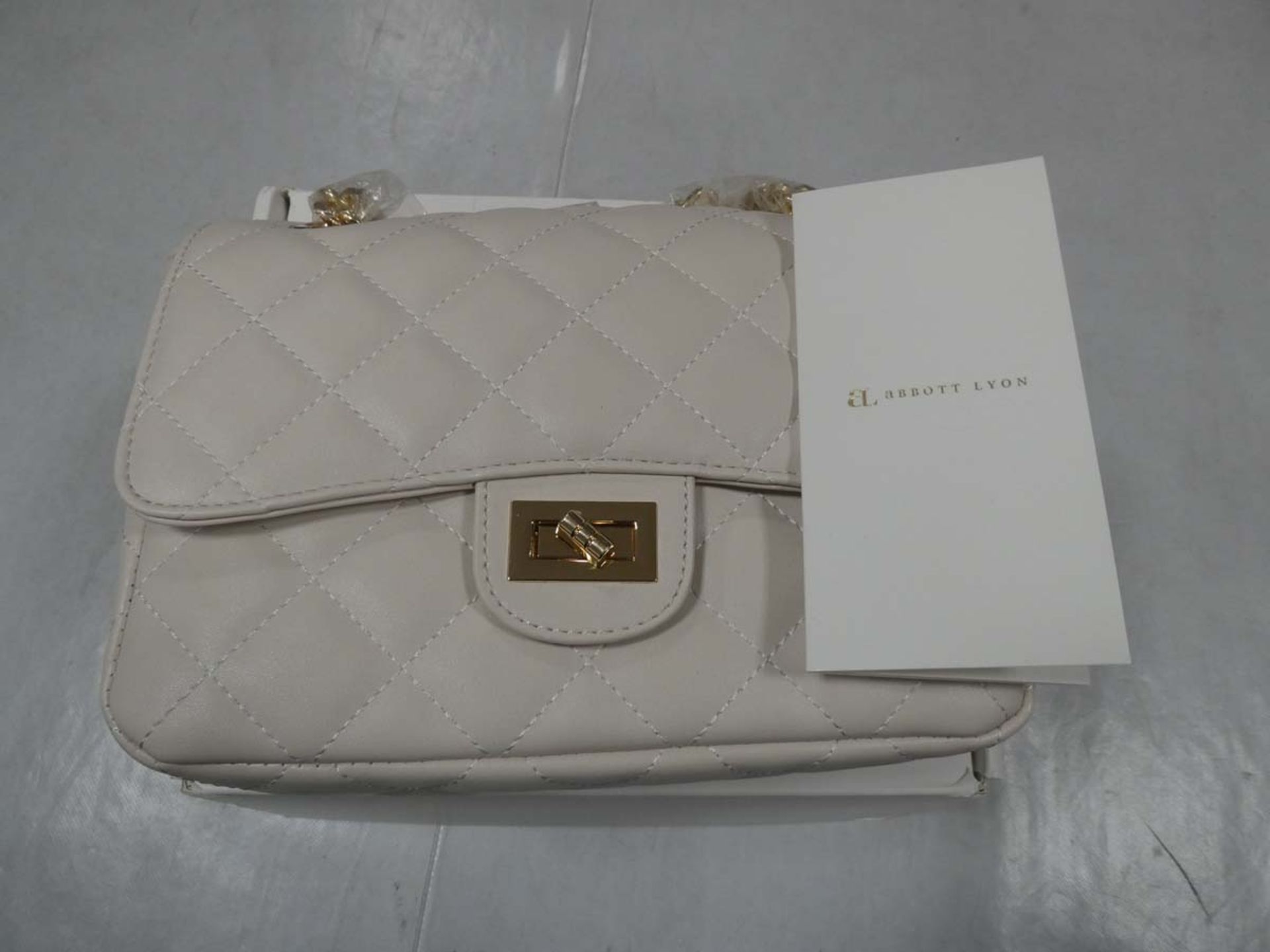 Abbot Lyon ivory flap quilted bag with yellow gold strap in box