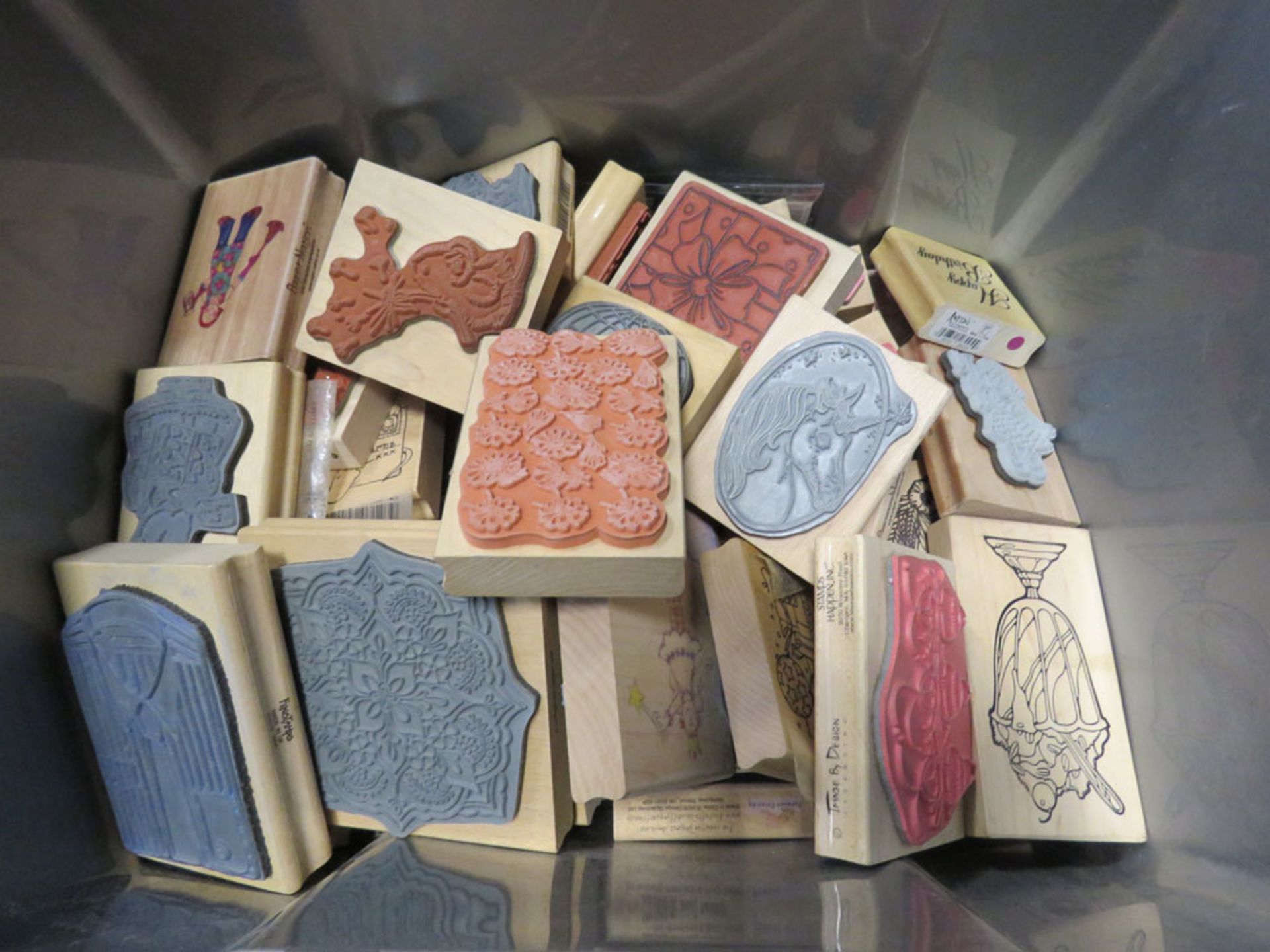 Box of various wooden toy stamps