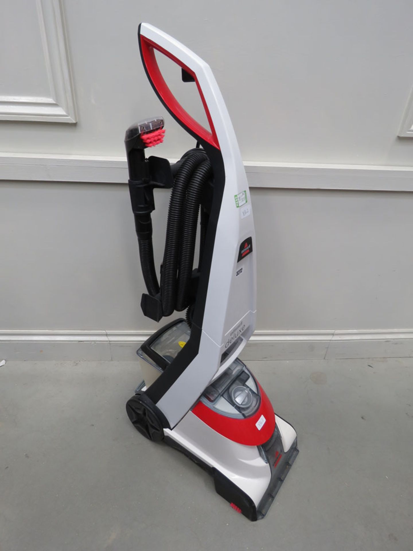 (85) Upright Bissell Deluxe floor cleaner