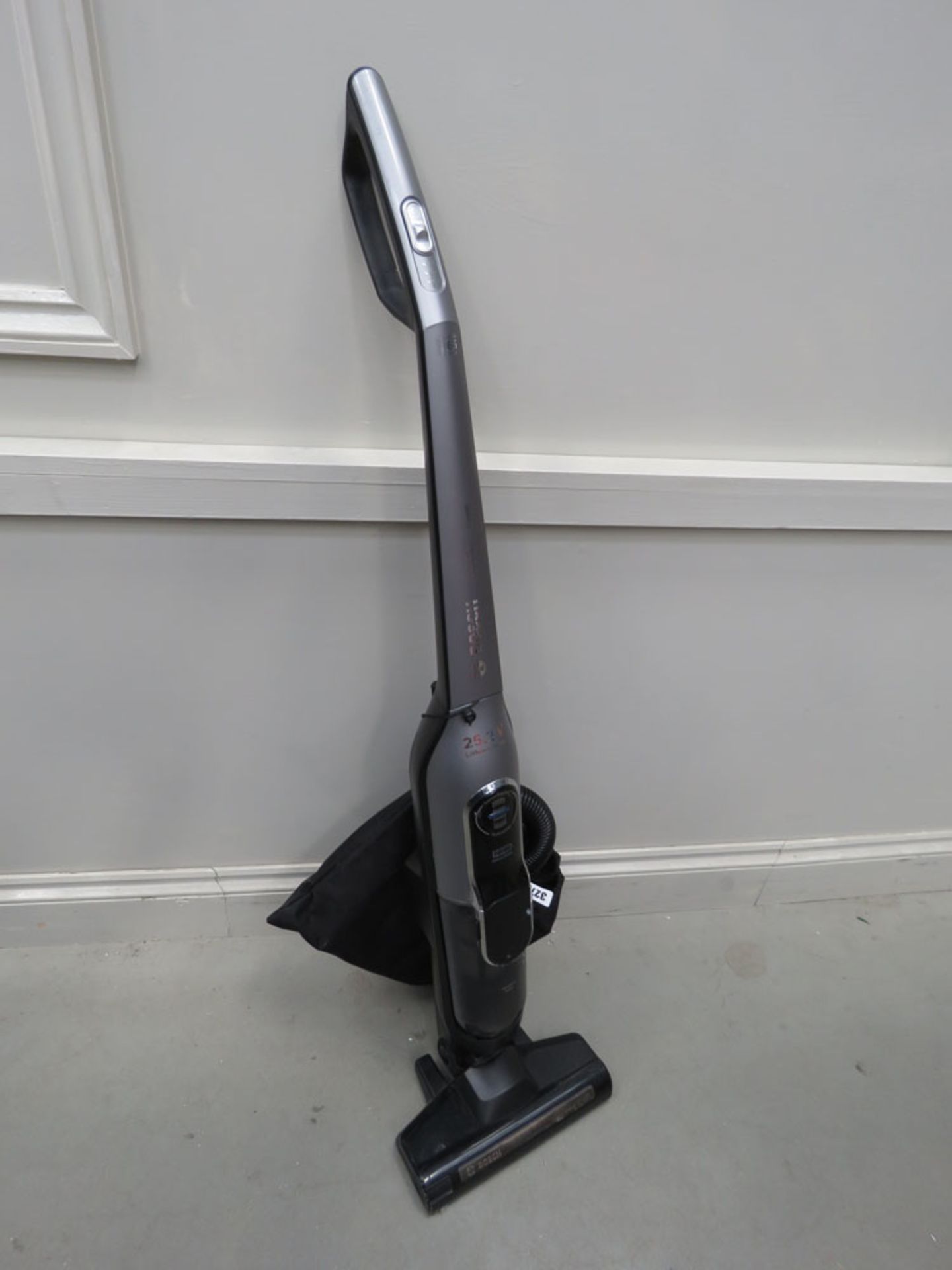 Upright Bosch 25.2V vacuum with accessories and charger