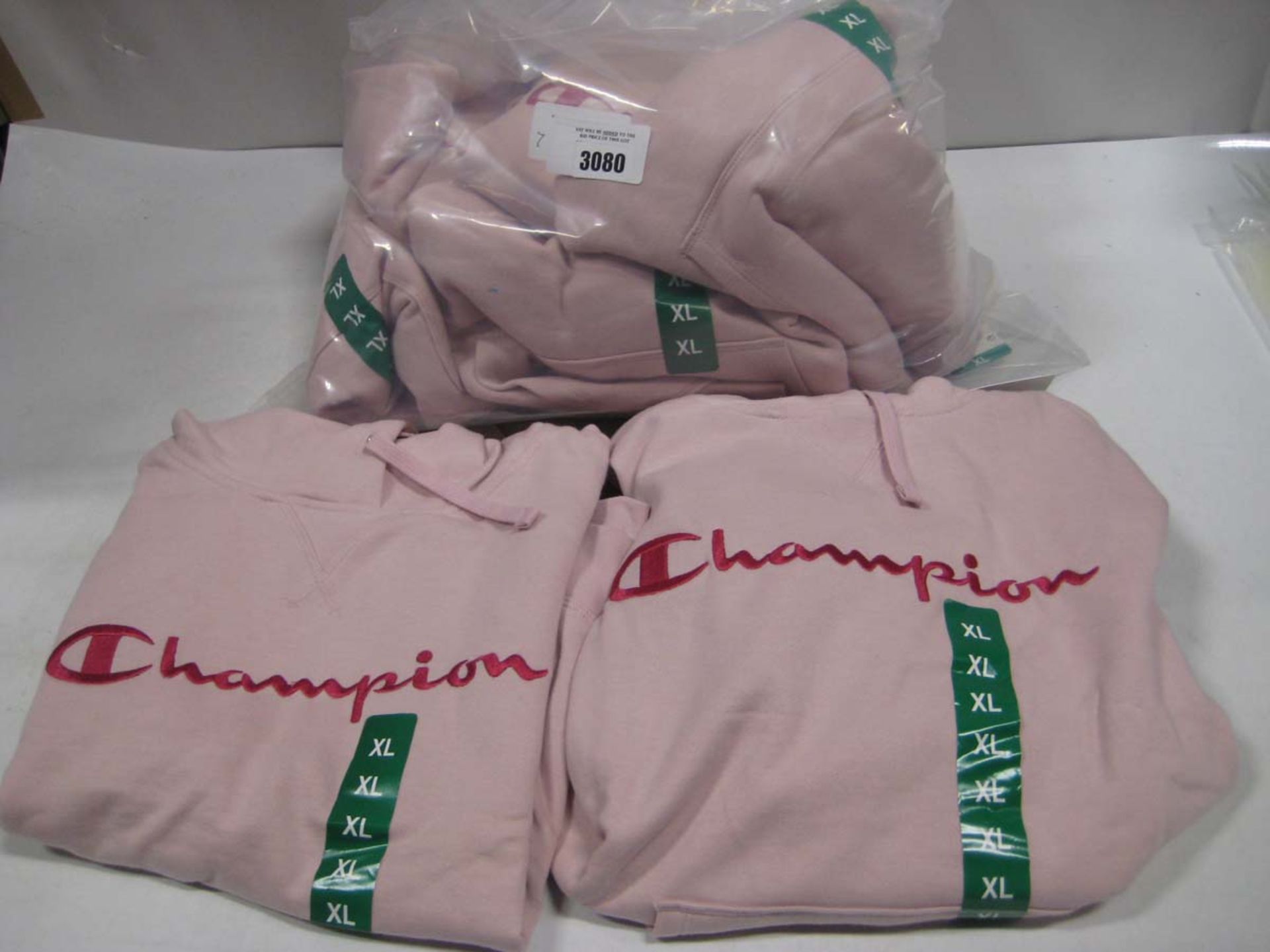 Bag containing 7 Champion ladies hoodies in pink