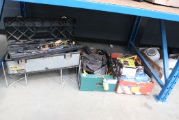 Underbay containing 2 cardboard and 1 toolbox with toolbelts, small tools, saws, safety harness,