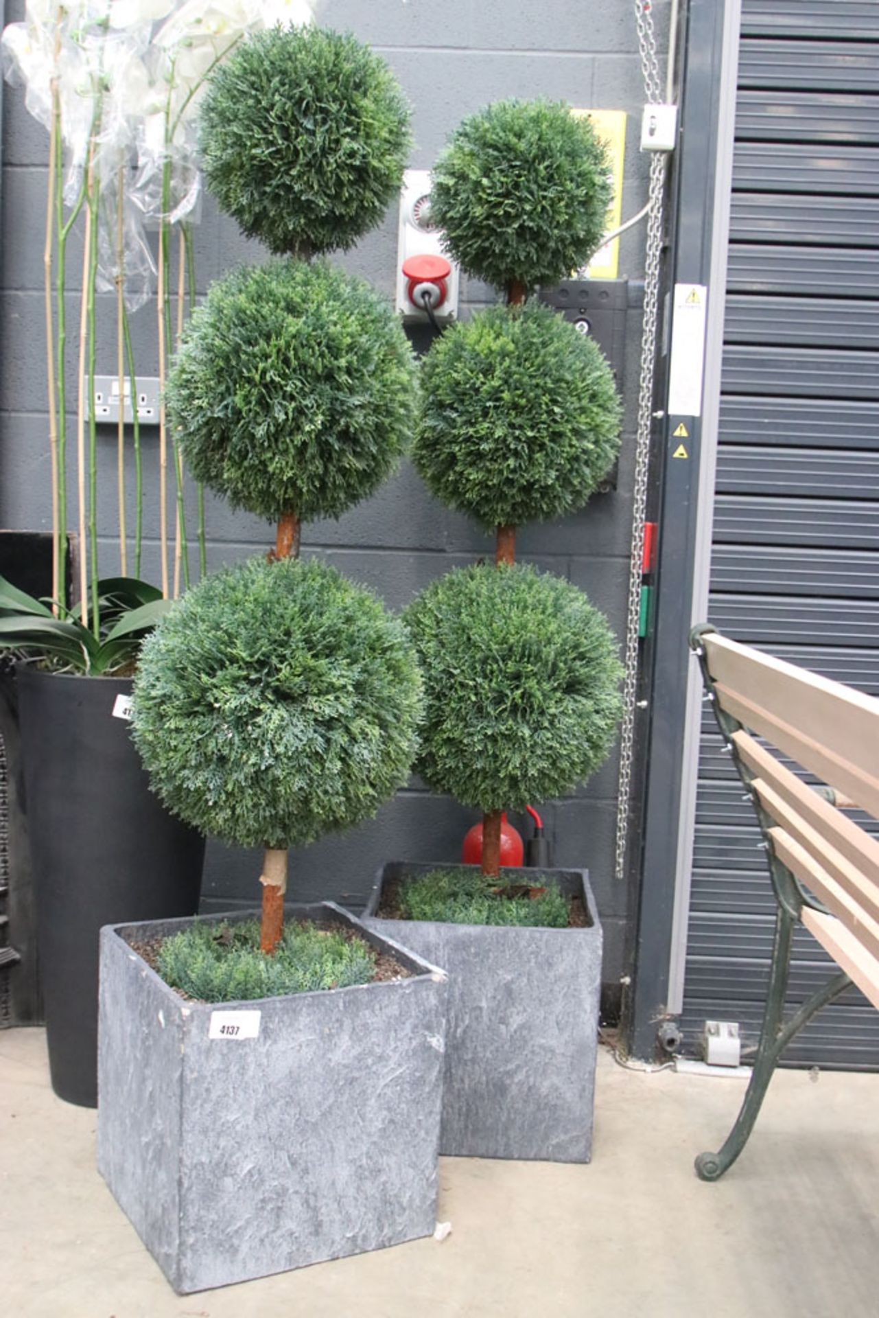 Two artificial buxus ball plants