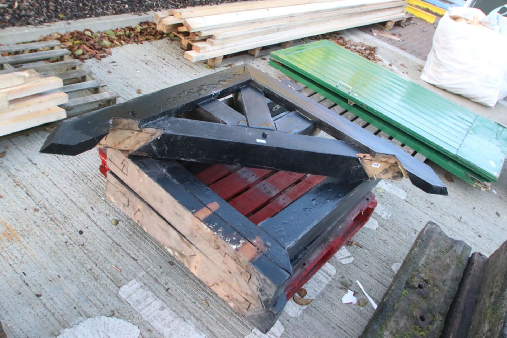 Pallet containing large wooden canopy brackets